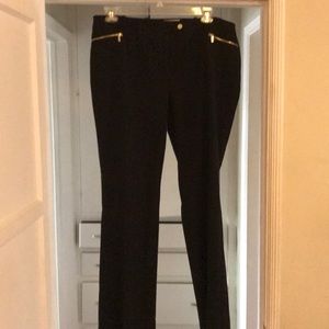 Calvin Klein black pants with gold accents.